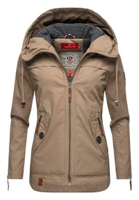 Beige outerwear jacket made of fabric with a roomy hood, zippered front, two front pockets, and striped inner lining. Features logo and drawstring.