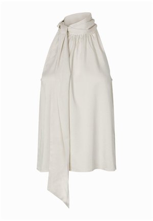 Krämfärgad ärmlös blus med knytkrage, rynkad halsringning och slätt tyg. Har en lös, flödande silhuett.