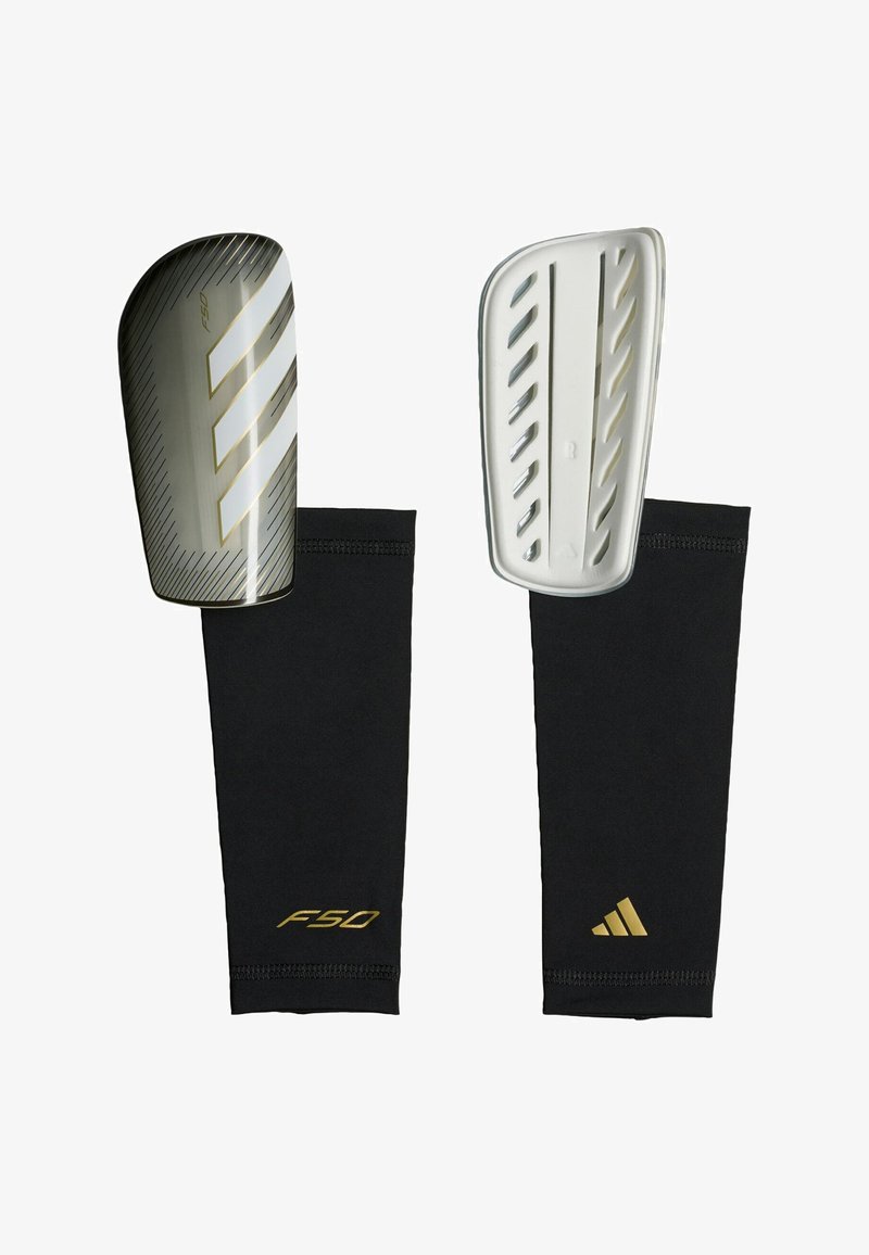 Pair of black and gold Adidas F50 soccer shin guards with hard protective shells and matching compression sleeves.