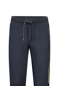 Marineblaue Jogginghose mit einem strukturierten elastischen Bund, Kordelzug, seitlichen Taschen und grünen Akzentstreifen entlang der Beine.