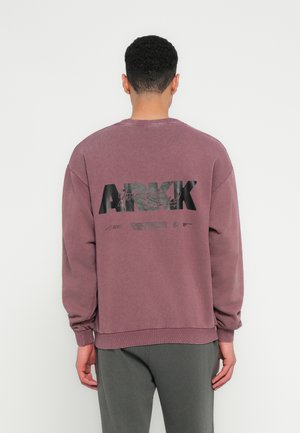 Maroon sweatshirt with a crew neckline and ribbed cuffs, featuring a large black "ARKK" logo and text on the back. Cotton-blend fabric.