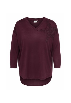 Haut à manches longues prune violet avec col en V et décoration étoile en strass sur le haut gauche de la poitrine, coupe décontractée avec ourlet incurvé.