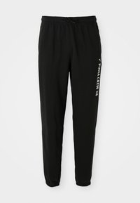 Zwarte tapersweatpants met elastische tailleband en boorden, witte tekst en logo "PUMA CREW '48" op de linker bovenbeen.