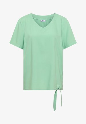 Jasnozielona bluzka z krótkim rękawem, dekoltem w serek i wiązanym detalem po boku u dołu.