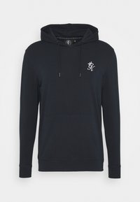 Tmavě modrá mikina s kapucí, přední kapsou, šňůrkou na kapuci a malým bílým logem na levé hrudi. Měkká látka s žebrovanými manžetami a spodním okrajem.