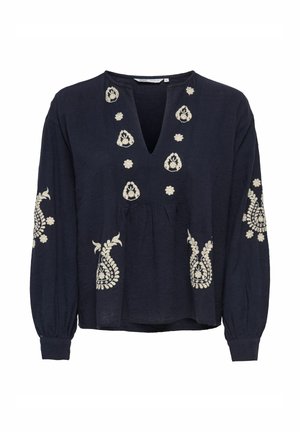 Blouse à manches longues bleu marine avec broderie florale blanche le long du col, des manches et de l'avant, dotée d'un col en V et d'un détail de taille froncée.