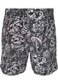 Schwarze Badehosen mit detailliertem weißem Tattoo-ähnlichem Druck, der Schädel, Rosen, Anker und verschiedene nautische Elemente zeigt.