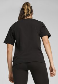 Puma Camiseta estampada - black