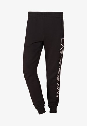 Pantaloni sportivi neri realizzati in tessuto morbido, con un design affusolato, vita elastica e branding stampato in bianco sulla gamba sinistra.