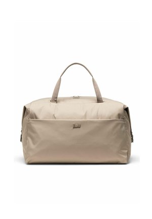 Sac de sport rectangulaire beige avec double poignées, poche avant zippée et logo de marque discret sur une surface en tissu lisse.
