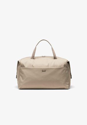 Sac de sport rectangulaire beige avec double poignées, poche avant zippée et logo de marque discret sur une surface en tissu lisse.