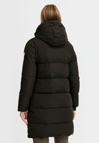 Black puffer coat with a hood, featuring a quilted design, long sleeves, and a mid-length cut, made of smooth, insulated material.
