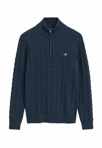 Dunkelblauer Pullover mit hohem Rippenkragen, Viertelreißverschluss und Zopfmuster. Kleines Logo auf der Brust.