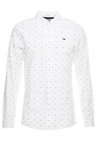 Camicia bianca con collo button-up e maniche lunghe, caratterizzata da un motivo di piccole pois multicolori. Include un piccolo logo sul petto.