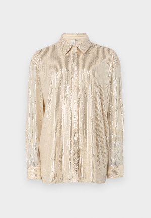 Chemise à paillettes dorées avec un col, des manches longues et des motifs à rayures verticales. Texture lisse avec des paillettes et fermeture à boutons.