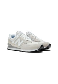 Light grey New Balance sneakers feature leather and mesh material, textured suede accents, white logo, and a rubber sole with black detailing.