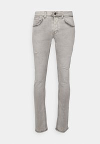 Bleka grå denimjeans med slim fit, med slitna detaljer, fem fickor och knappstängning. Slät textur med synlig sömnad.