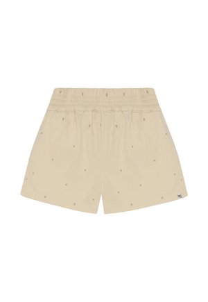Beige shorts with an elastic waistband, featuring small, evenly spaced tan dots and a logo tag on the lower side.