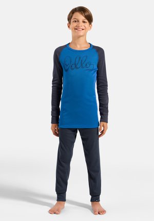 Blue long-sleeve top with dark gray sleeves featuring a textured "Hello" print, paired with dark gray pants, both in a soft fabric.