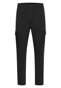 Black cargo pants made of soft fabric, featuring a drawstring waistband, tapered legs, and two side cargo pockets.