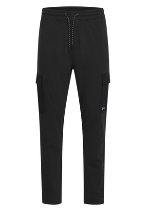 Black cargo pants made of soft fabric, featuring a drawstring waistband, tapered legs, and two side cargo pockets.