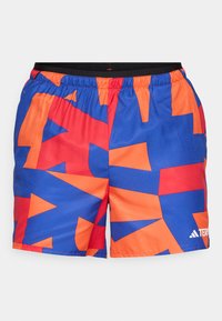 Swim shorts made of lightweight fabric with a geometric pattern in blue, orange, and red, featuring an elastic waistband and logo detail.