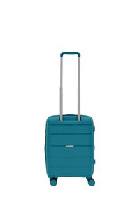 Valigia rigida turchese con superficie texturizzata, dotata di maniglia estraibile e quattro ruote girevoli per una facile manovrabilità.