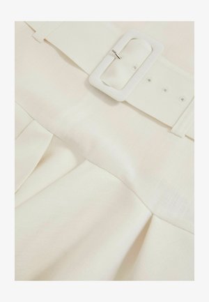 Light cream skirt with pleats and a wide fabric belt featuring a rectangular buckle. Smooth texture with subtle pattern detail.