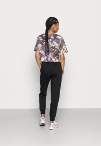 Nike Sportswear Treniņtērpa apakšdaļas - black/white