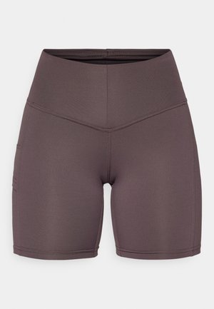 High-waisted, fitted shorts made of soft, stretchy fabric in a muted brown color. Features flatlock seams and side pockets.