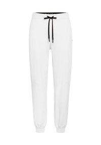 Witte trainingsbroek met een zwarte trekkoord, elastische boorden en zijzakken. Eenvoudig ontwerp met een zachte textuur en lichtgewicht materiaal.
