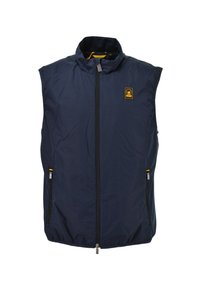 Veste sans manches bleu marine à fermeture éclair avec col montant, deux poches zippées et un petit logo jaune et noir sur la poitrine.