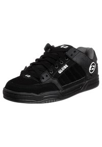 Black low-top sneakers made of suede and synthetic materials. Features include lace-up design, padded collar, and textured rubber sole with logo accents.