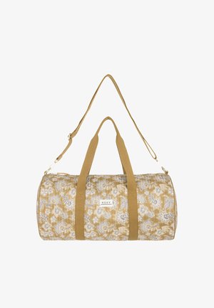 Tan kleurige cilindervormige reistas met een bloemenpatroon, twee korte handvatten, een lange verstelbare schouderband en een "Roxy" merklabel aan de voorkant.