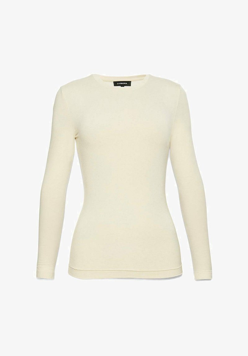 Hosszú ujjú, világos krém színű póló, puha anyagból készült. Kerek nyakú és testhez simuló fazonnal rendelkezik, látható minták nélkül.