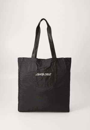 Black tote bag made of lightweight material, featuring two black fabric handles and a white "SANTA CRUZ" logo on the front.