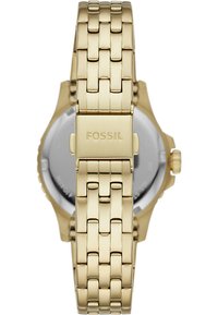Gold stainless steel watch featuring a woven bracelet design, a round silver dial with minimalistic hour markers, and a side crown.