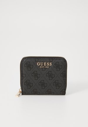Black zip-around wallet with diamond pattern, gold hardware, and "GUESS EST 1981" logo on the front. Durable fabric construction.