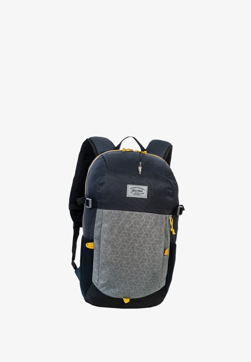 Sac à dos en tissu gris et noir, avec des accents jaunes, motif géométrique, poche frontale zippée, bretelles rembourrées et une poignée supérieure.