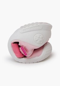 White and pink folding shoe with a textured rubber sole, soft fabric upper, and an adjustable strap. Compact design for easy storage.