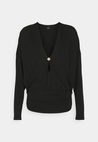Black long-sleeve blouse with a deep V-neck and a twisted front design, featuring a gold button accent and gathered waist detail.