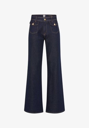 Dunkelblaue Schlagjeans aus Denim mit kontrastierenden orangefarbenen Nähten, hoher Taille, zwei Fronttaschen und Hardware-Details in Goldfarbe.