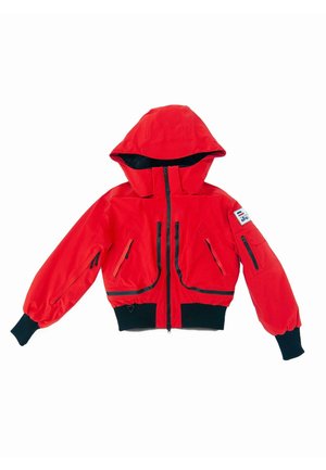 Red waterproof jacket with a hood, featuring black zip accents, elastic cuffs, and multiple zipped pockets. Cropped design with soft texture.