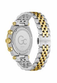 Zegarek ze stali nierdzewnej z bransoletą z linków w odcieniach srebra i złota. Ośmiokątna koperta, zakręcana koronka oraz szafirowe szkło. Grawerowane tylne wieko.