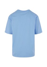 Light blue cotton t-shirt with a round neck and short sleeves. The back features a smooth texture, hemmed edges, and minimal detailing.