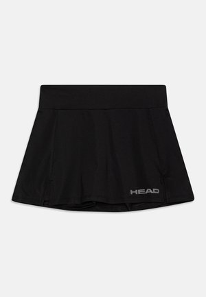 Jupe de sport noire en tissu élastique, avec une large taille, des plis, et un petit logo sur le bas à gauche.