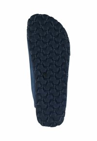 Shoe sole in black rubber with a hexagonal tread pattern; flat shape, smooth edges, and slightly raised texture for grip.
