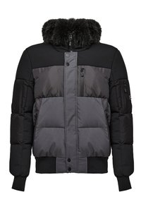 Padded jacket in black and dark gray, featuring a faux fur collar, zippered pockets, and ribbed cuffs and waistband for a snug fit.