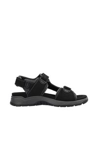 Sandales noires avec des sangles réglables, dotées d'une semelle rembourrée, d'un dessus en textile et d'une semelle extérieure en caoutchouc ; accents de couture argentée.