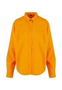 Oranget skjorta med knäppning, krage, långa ärmar, rundad nederkant och en enkel struktur. Tyget verkar lätt och enfärgat utan mönster.